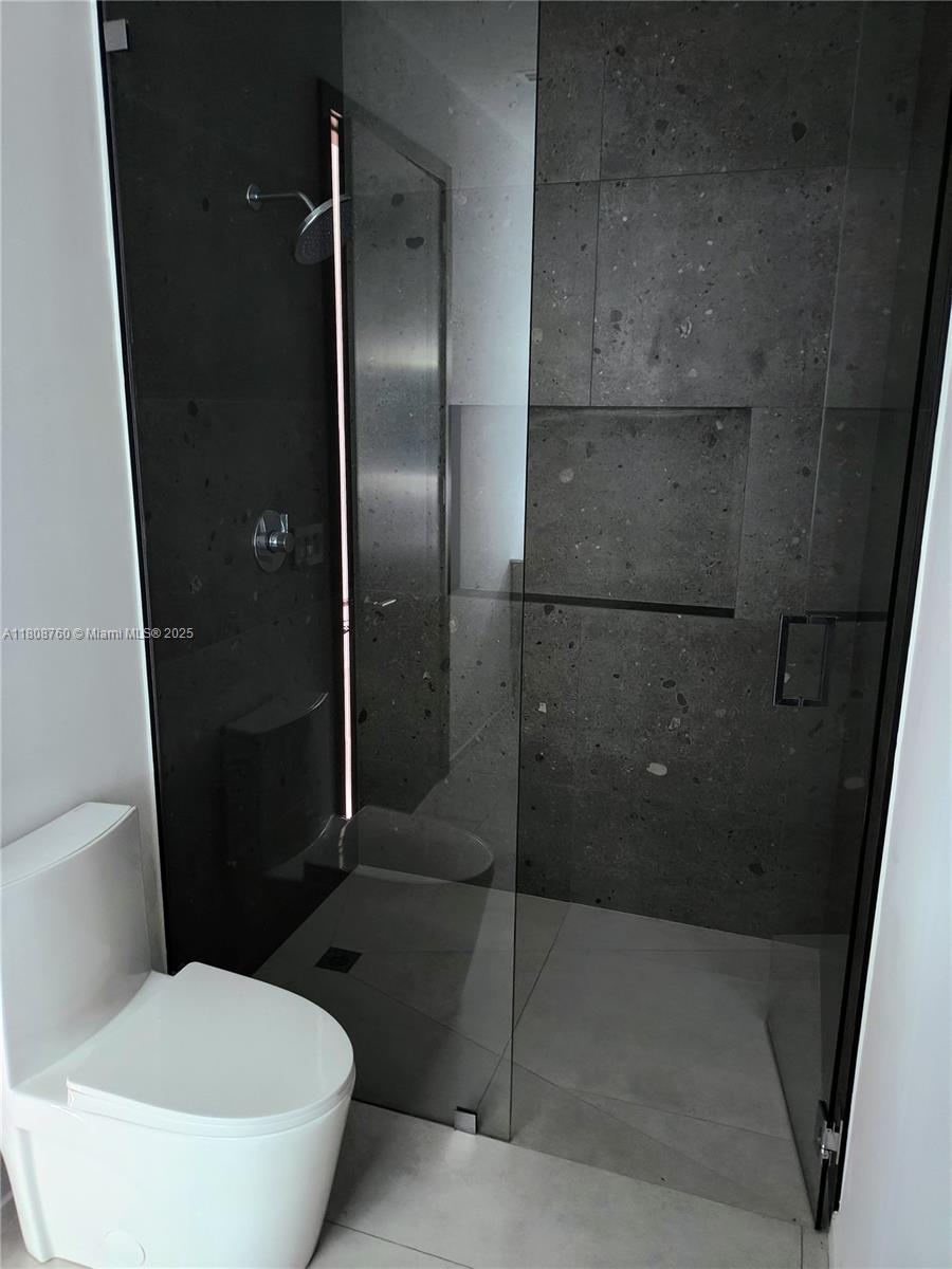 234 Southwest 22nd Road Miami, FL 33129 - Photo 20 of 31 a bathroom with a toilet and a shower