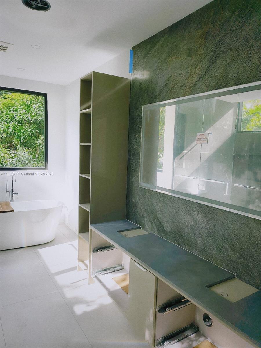 234 Southwest 22nd Road Miami, FL 33129 - Photo 27 of 31 a bathroom with a bathtub and a shower