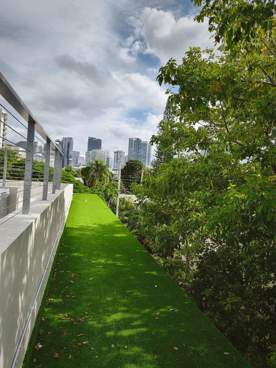 234 Southwest 22nd Road Miami, FL 33129 - Photo 30 of 31 a view of a house with a yard