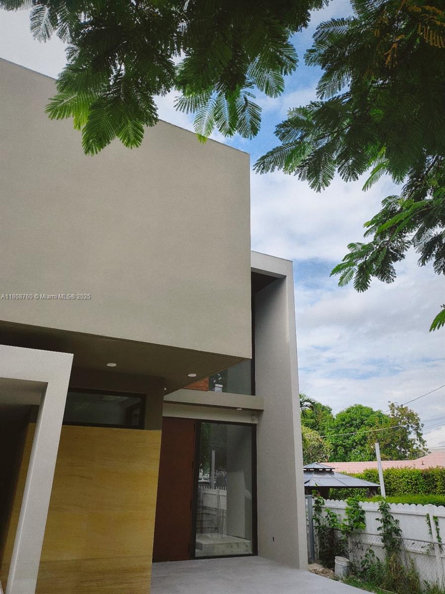 234 Southwest 22nd Road Miami, FL 33129 - Photo 5 of 31 a front view of a house with a yard