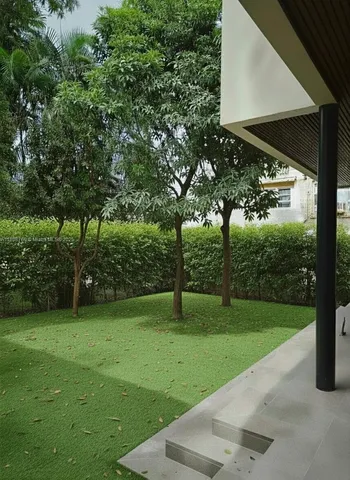 a view of balcony with wooden floor