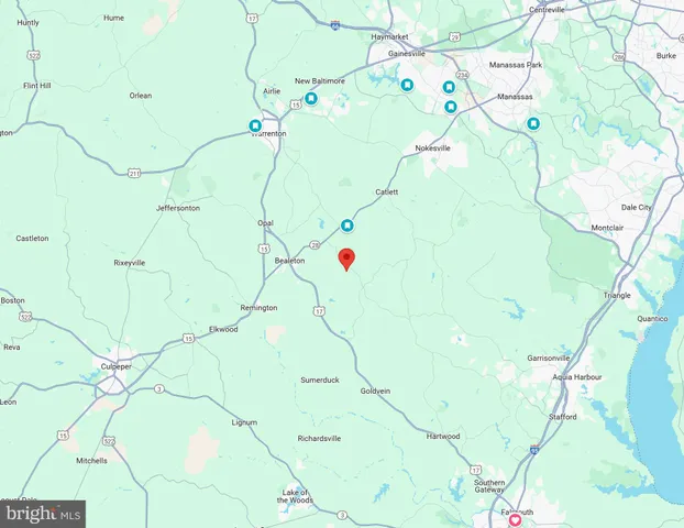 a white bench sitting in front of a tree