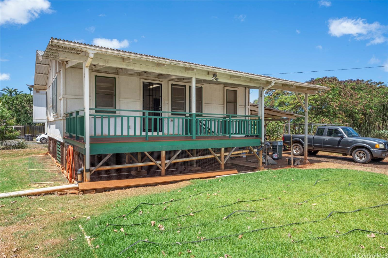 66-195 Kaamooloa Road, Unit B Waialua, HI 96791 - Photo 12 of 15 a view of a house with backyard porch and sitting area