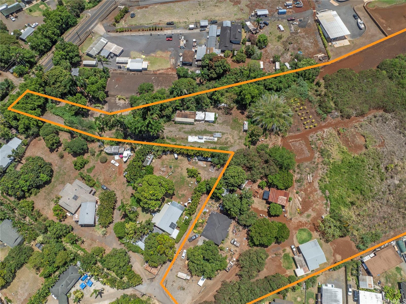 66-195 Kaamooloa Road, Unit B Waialua, HI 96791 - Photo 4 of 15 an aerial view of a city and mountain view in back