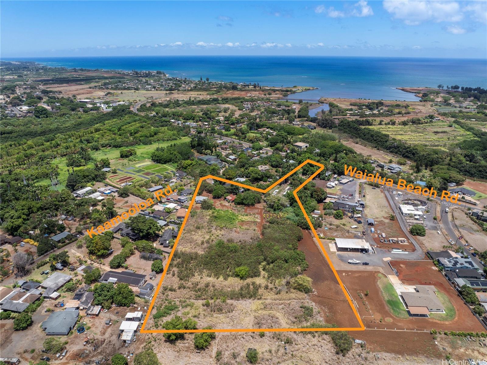 66-195 Kaamooloa Road, Unit B Waialua, HI 96791 - Photo 8 of 15 an aerial view of residential houses with outdoor space