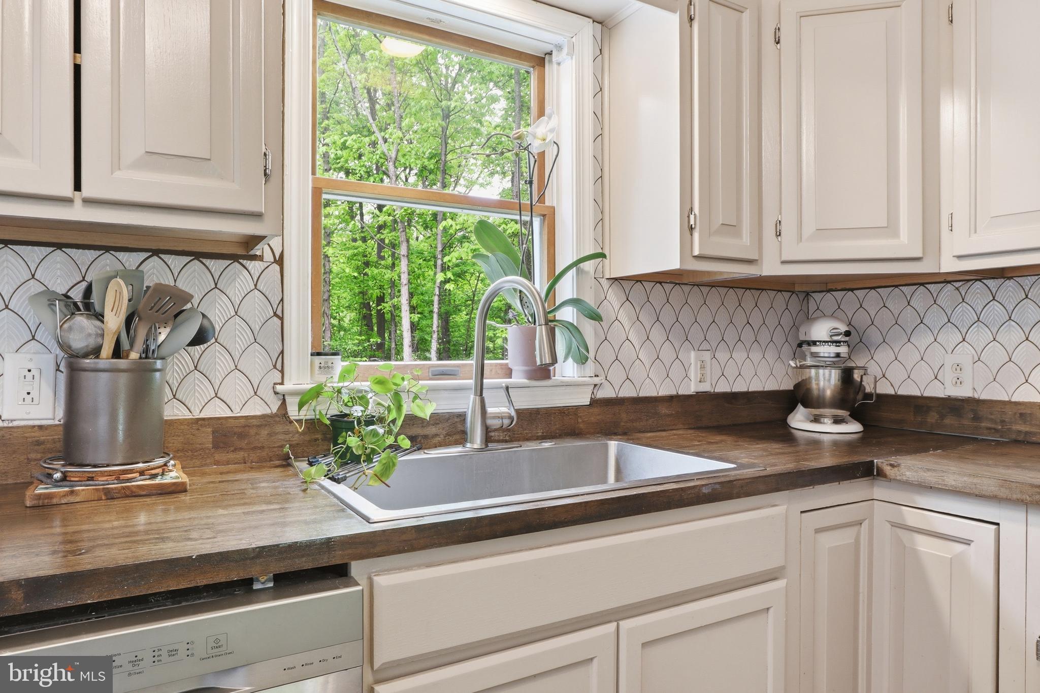 162 Jackson Road Gettysburg, PA 17325 - Photo 14 of 37 a kitchen with granite countertop white cabinets and a window