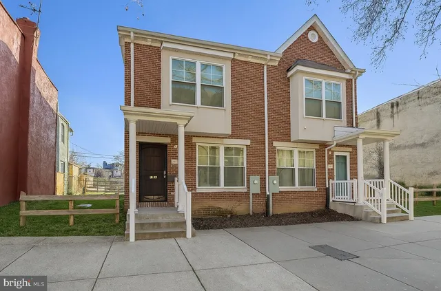 a view of kitchen with granite countertop cabinets and a sink