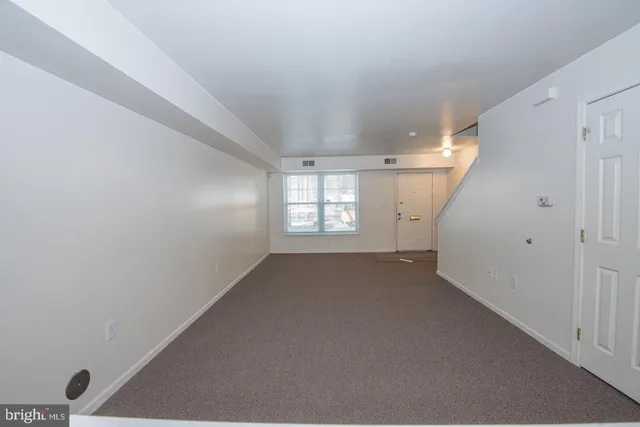 a kitchen with granite countertop cabinets stainless steel appliances and a sink