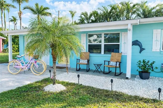 a view of a chairs and table in a backyard