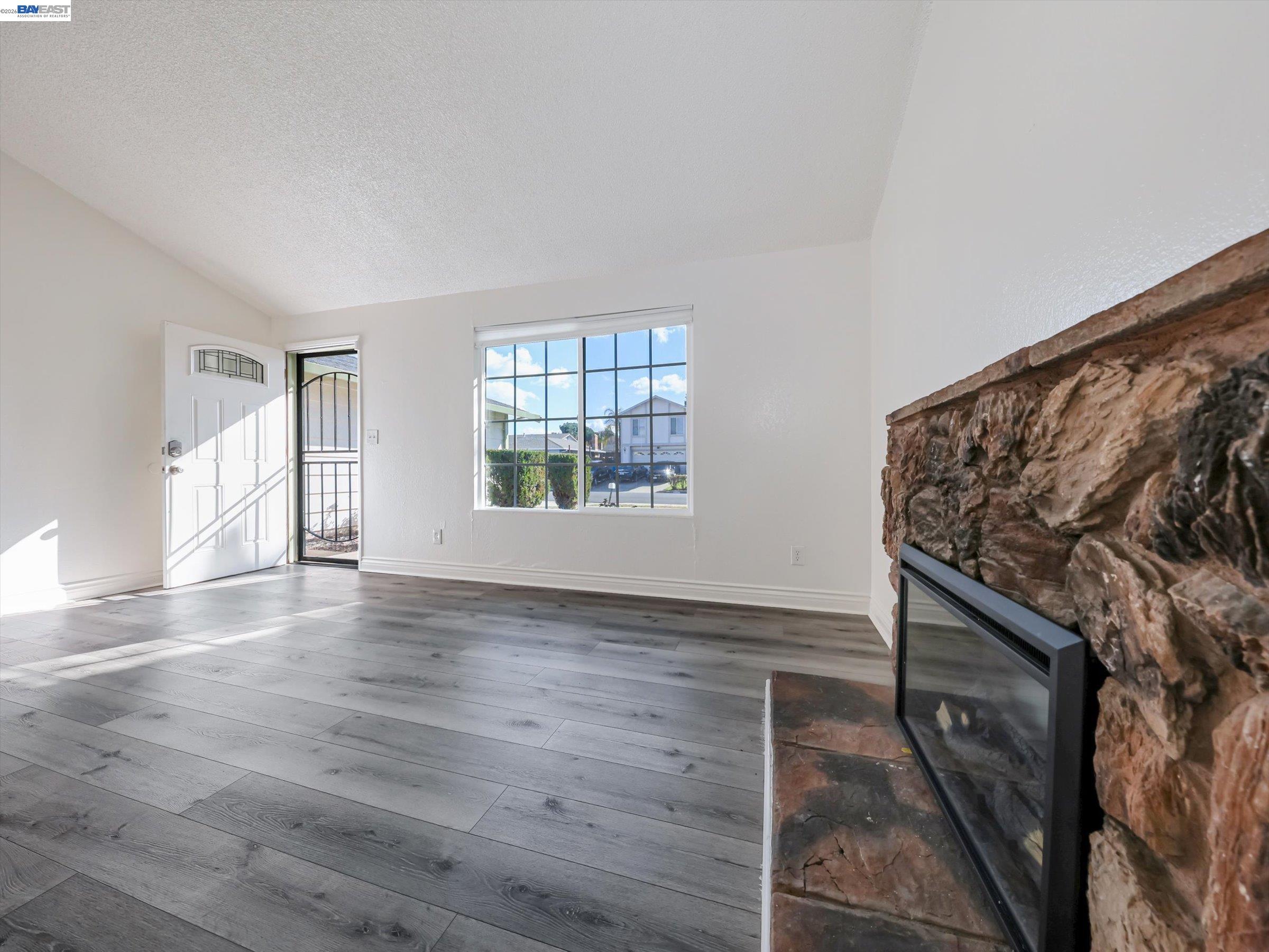 3432 Danielle Place Bay Point, CA 94565 - Photo 9 of 36 wooden floor in an empty room with a window