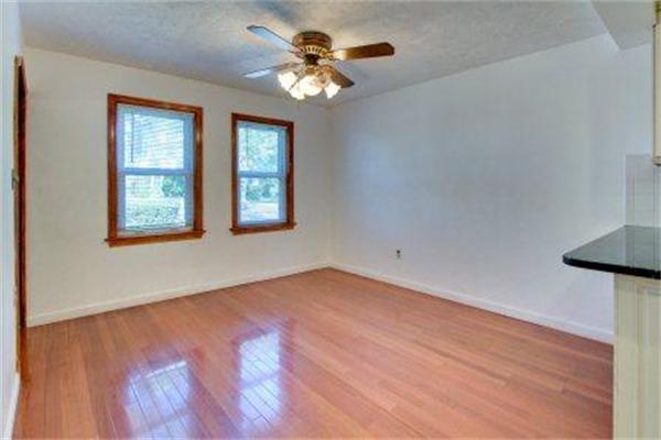 129 Russell Road Newton, MA 02465 - Photo 8 of 19 wooden floor in an empty room with a window