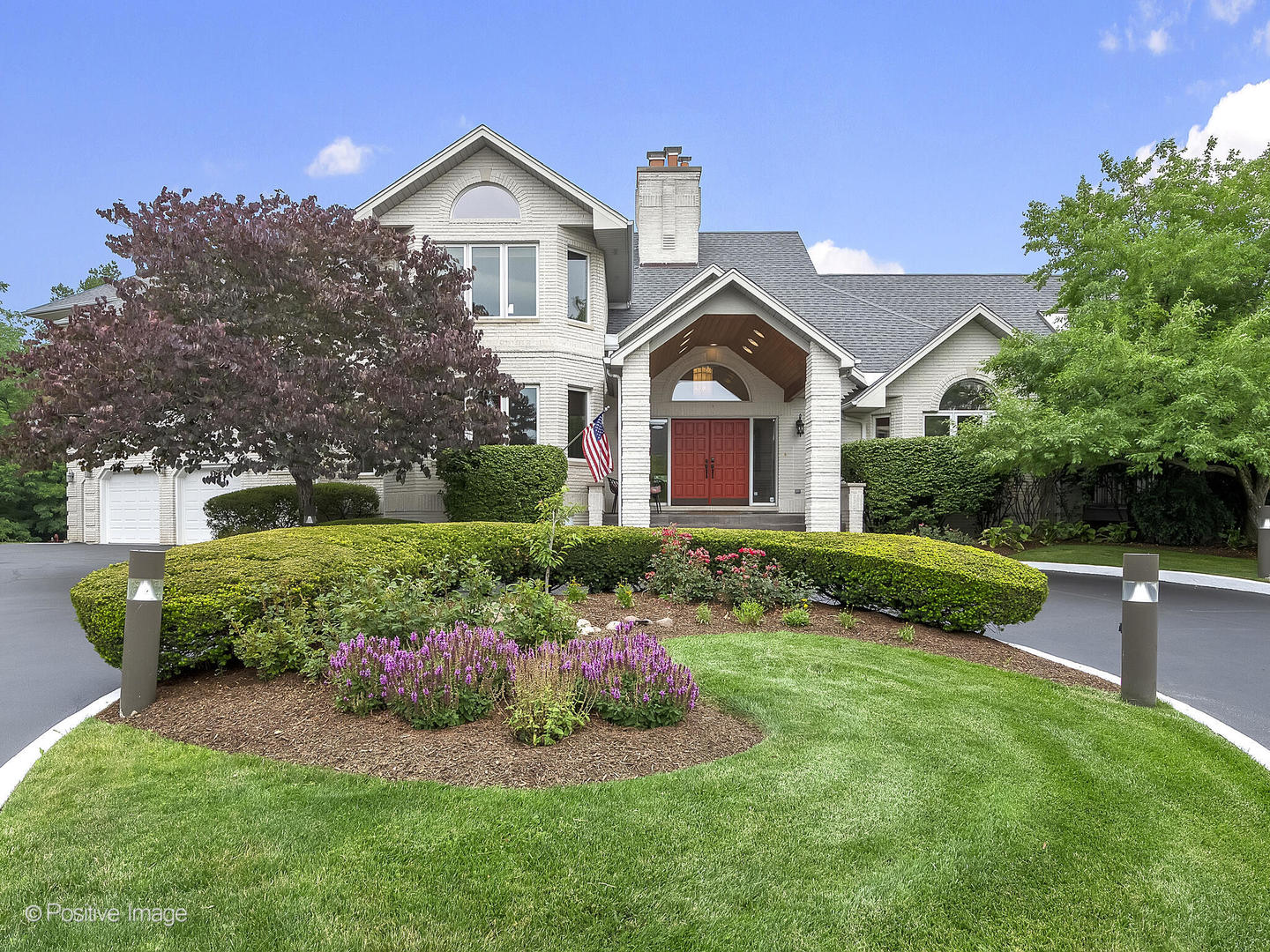 2004 Black Swan Court Darien, IL 60561 - Photo 1 of 54 a front view of a house with a garden and plants