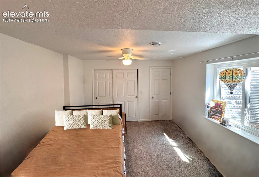 9362 St.George Road Peyton, CO 80831 - Photo 24 of 32 a view of room with window and ceiling fan