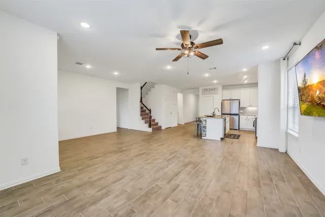a view of a kitchen with a sink and a window