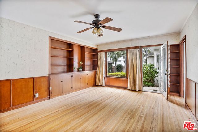 a view of a room with cabinet and windows