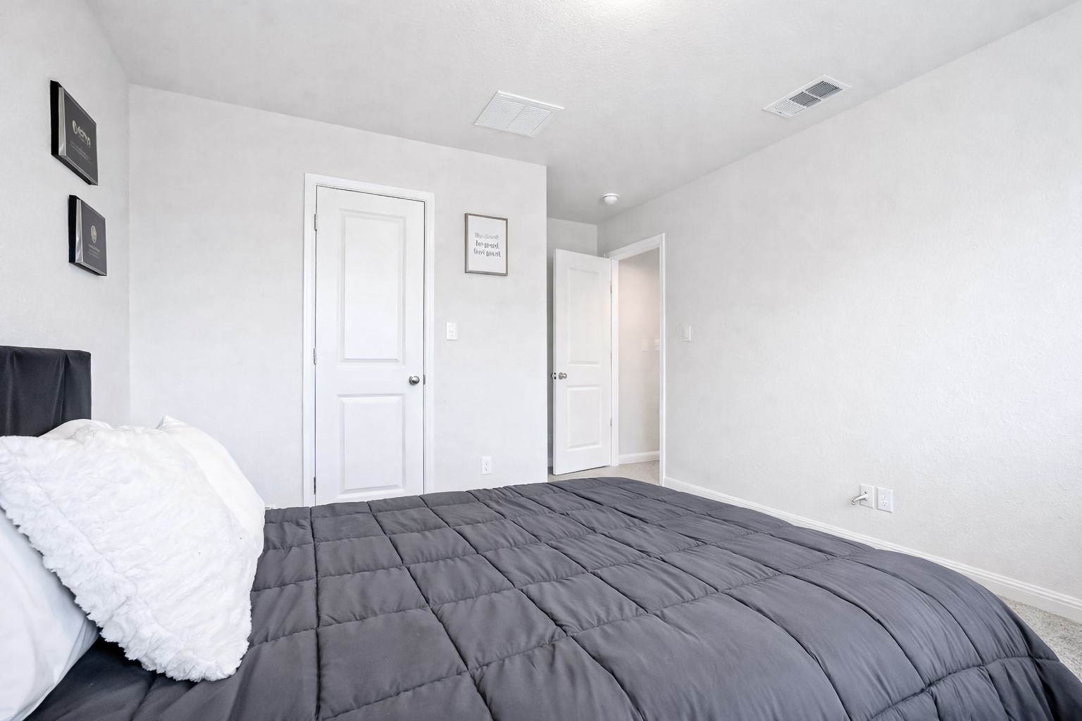 940 Paddock Lane Georgetown, TX 78626 - Photo 29 of 32 Carpeted room with white textured walls and a textured ceiling