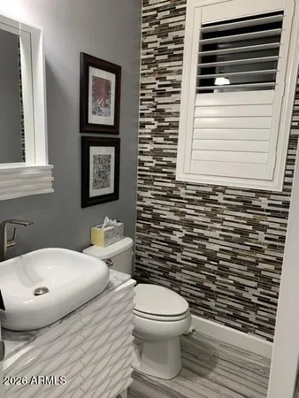 a bathroom with a toilet and a sink