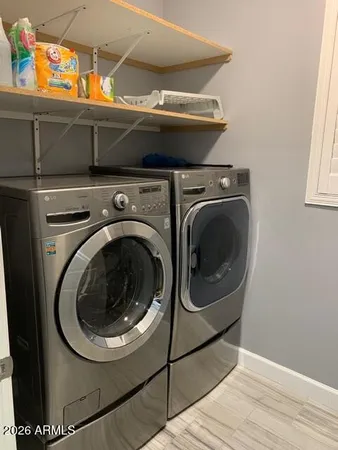 a utility room with dryer and washer