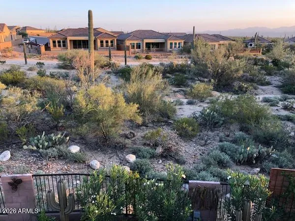 a view of a town with mountains and valleys
