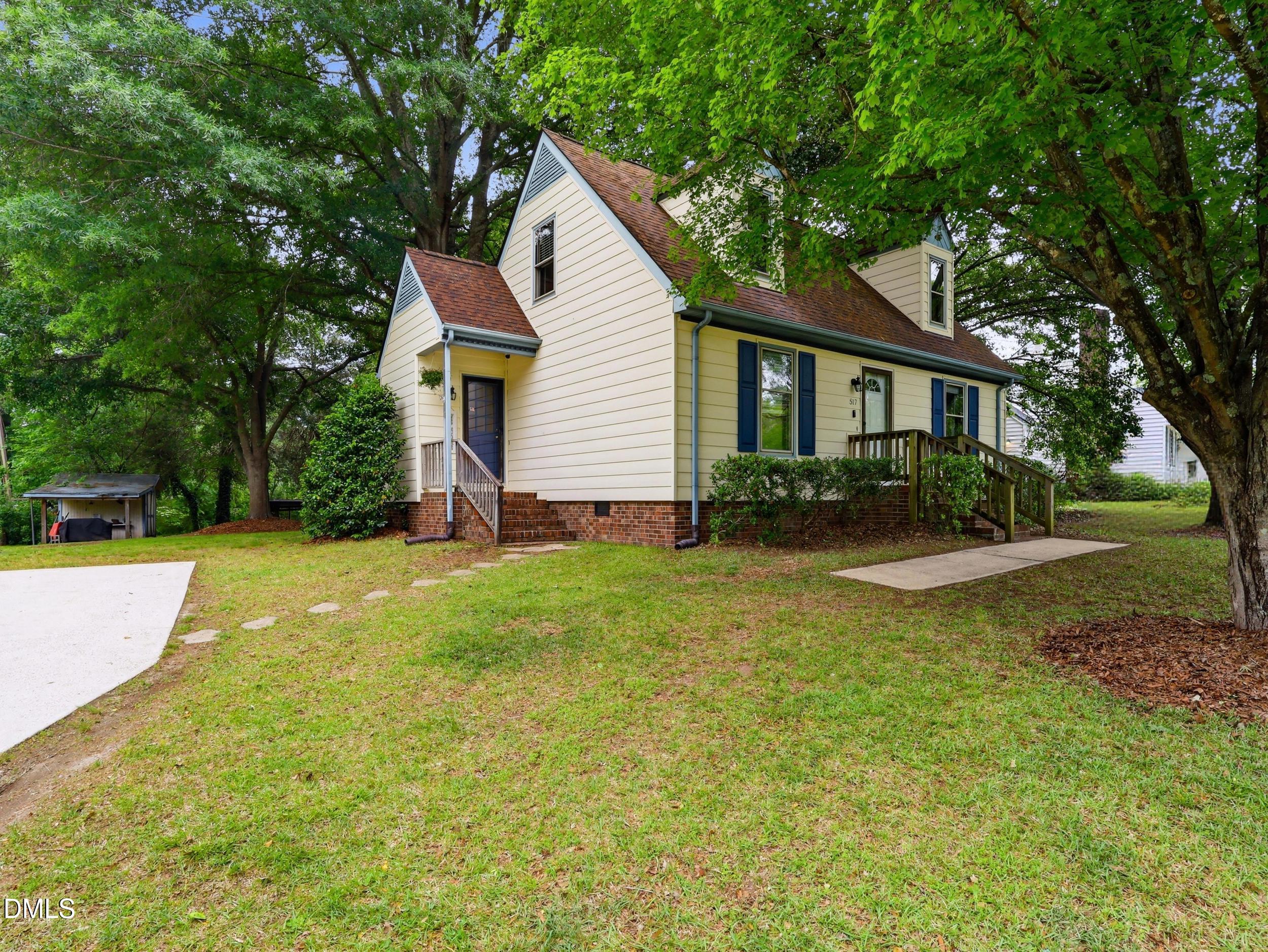517 Lake Glad Road Wendell, NC 27591 - Photo 5 of 36 a view of a house with backyard and tree s