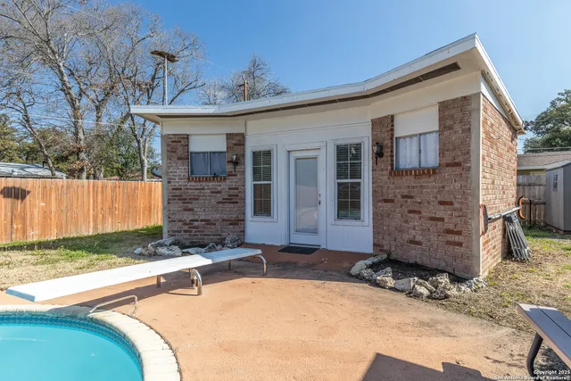 a view of a house with a tub and yard