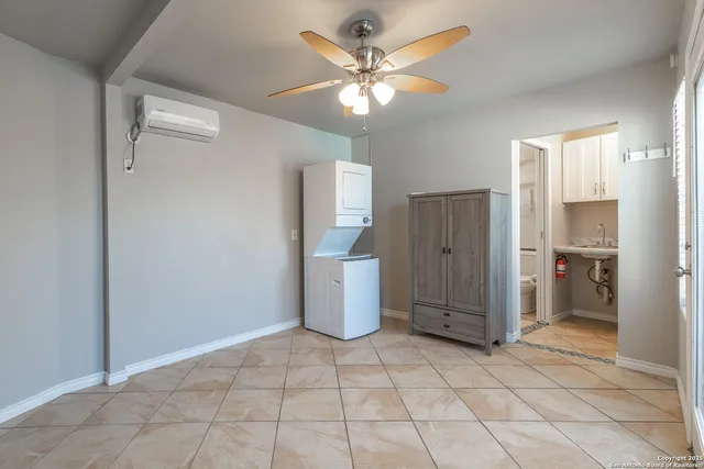 a view of a kitchen with a stove & cabinets
