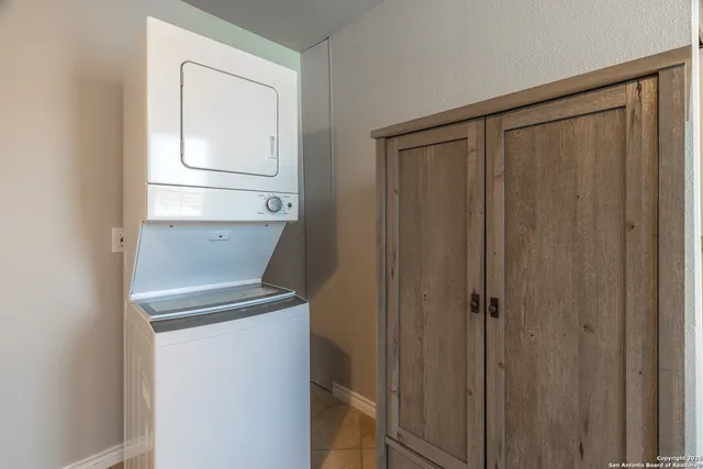 a kitchen with stainless steel appliances granite countertop a sink and a microwave