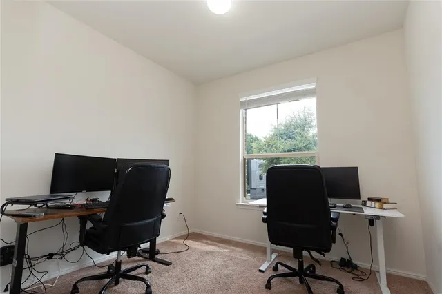 a workspace with furniture and a window