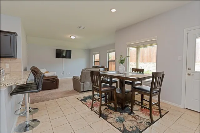 a view of a hallway with wooden shelves