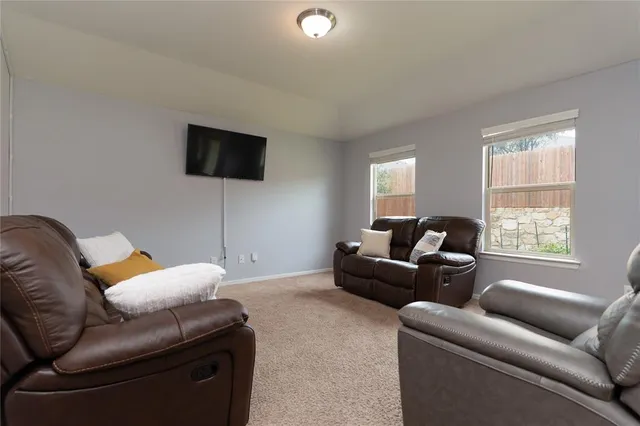 a spacious bedroom with a bed and a window