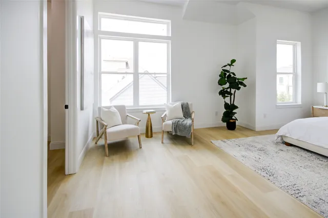 a bedroom with a bed and a couch