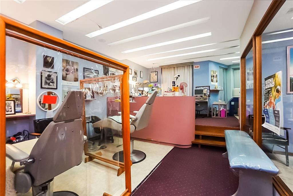 365 Bay Ridge Parkway Brooklyn, NY 11209 - Photo 17 of 33 a bed room with furniture and a flat screen tv