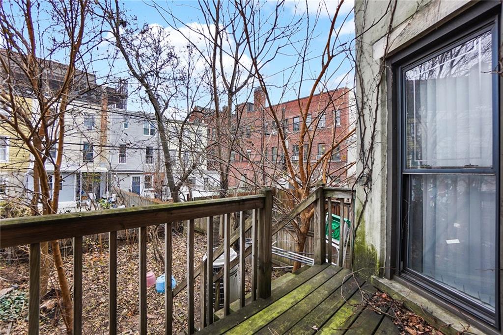 365 Bay Ridge Parkway Brooklyn, NY 11209 - Photo 20 of 33 a view of a balcony with wooden fence