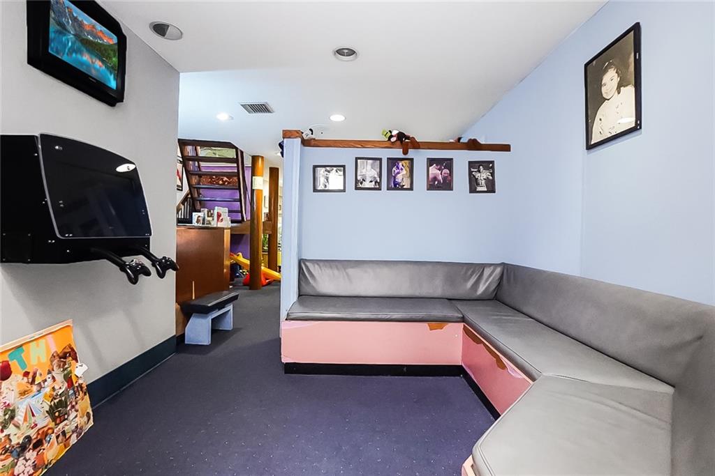 365 Bay Ridge Parkway Brooklyn, NY 11209 - Photo 2 of 33 a living room with furniture and a couch