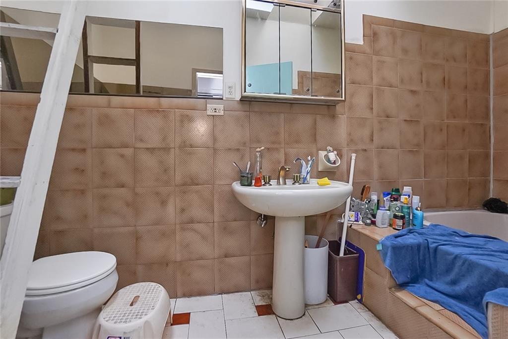 365 Bay Ridge Parkway Brooklyn, NY 11209 - Photo 23 of 33 a bathroom with a sink toilet and shower