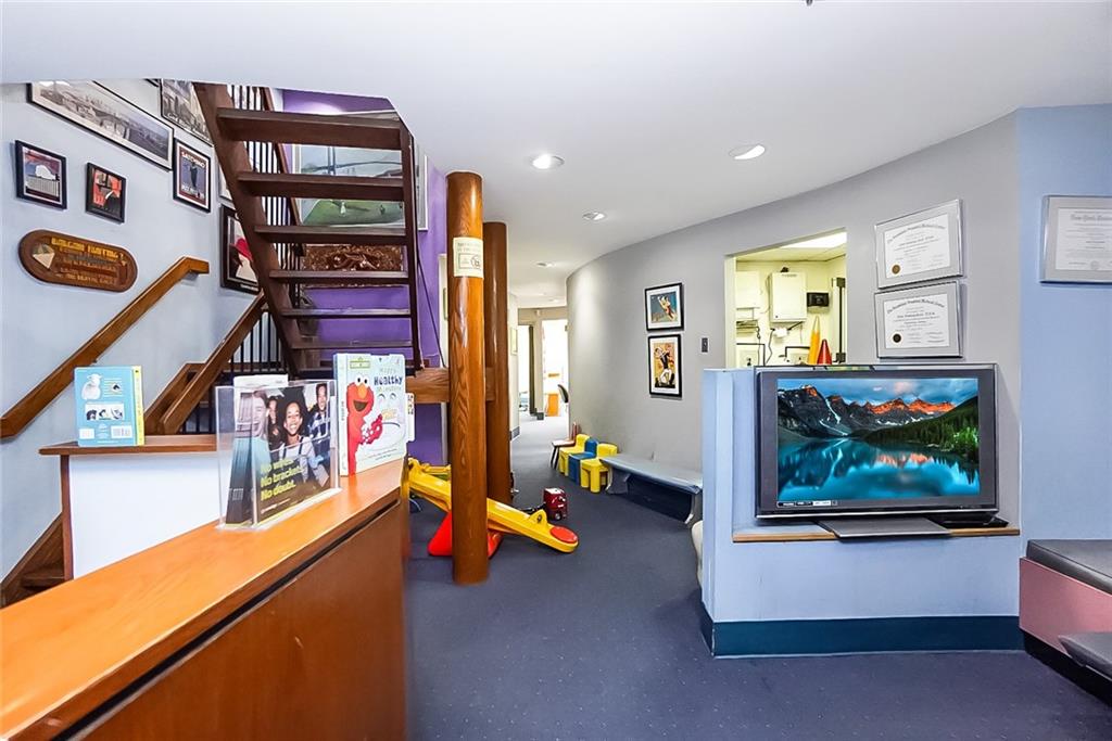 365 Bay Ridge Parkway Brooklyn, NY 11209 - Photo 4 of 33 a living room with furniture and flat screen tv