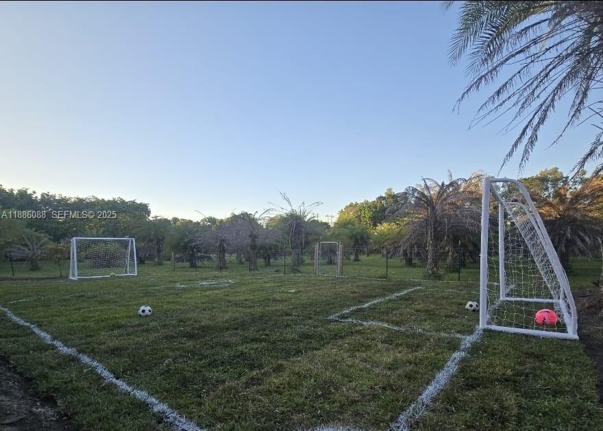 14001 Mustang Trail, Unit 1 Southwest Ranches, FL 33330 - Photo 20 of 31 a view of an outdoor space and a yard