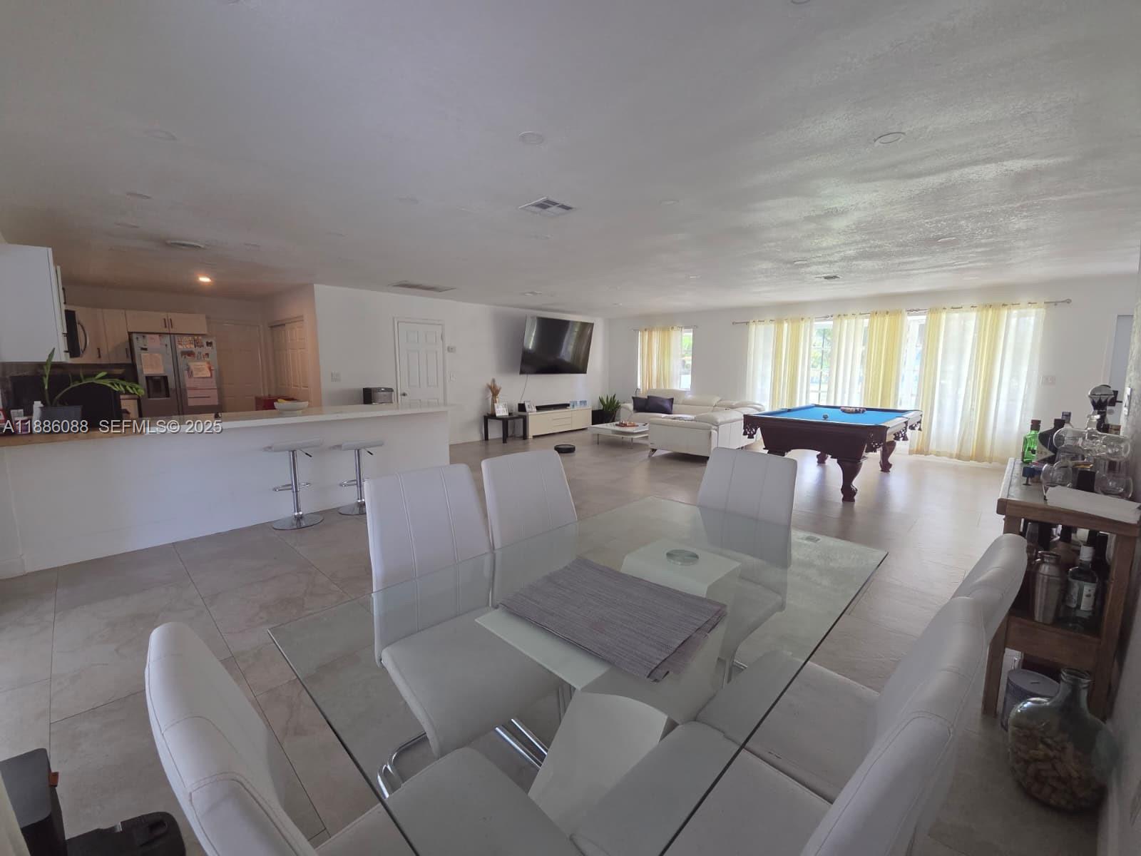 14001 Mustang Trail, Unit 1 Southwest Ranches, FL 33330 - Photo 29 of 31 a view of a dining room with furniture