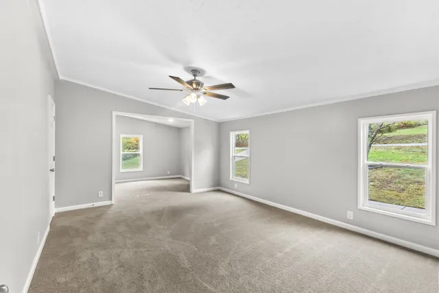 a view of an empty room with a window