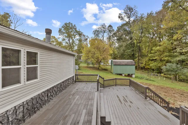 a view of balcony with wooden floor