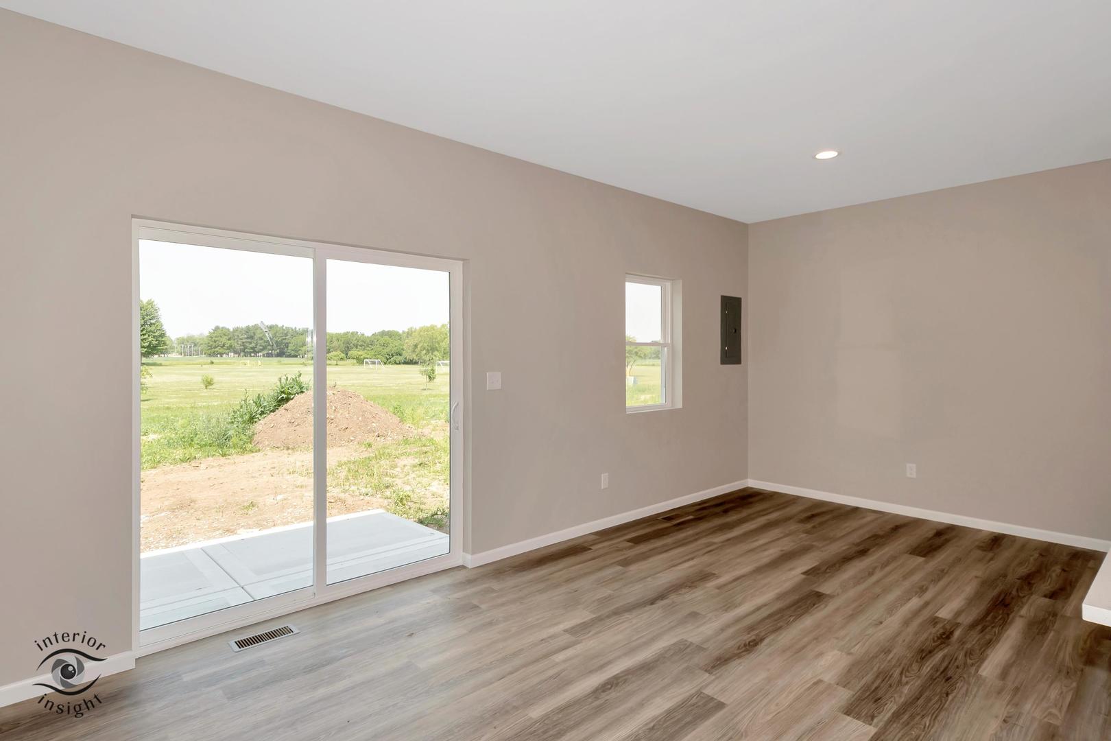 1321 Sioux Turn Kankakee, IL 60901 - Photo 12 of 34 a view of a big room with wooden floor and windows