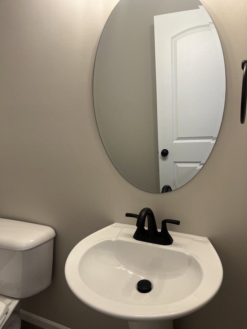 1321 Sioux Turn Kankakee, IL 60901 - Photo 13 of 34 a bathroom with a sink and mirror