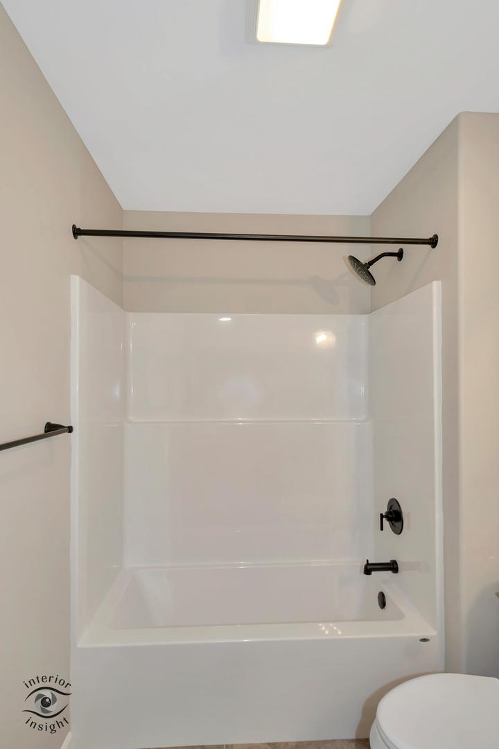 1321 Sioux Turn Kankakee, IL 60901 - Photo 18 of 34 a bathroom with a shower and a toilet