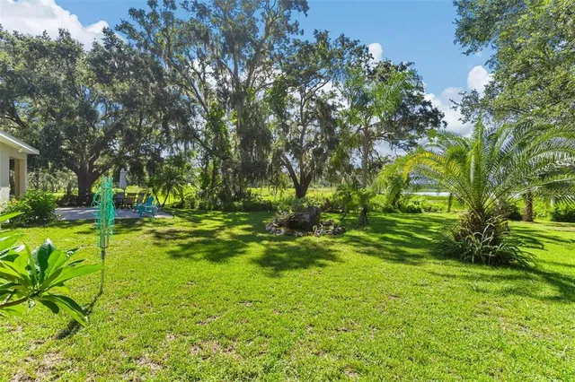 a view of backyard with swimming pool