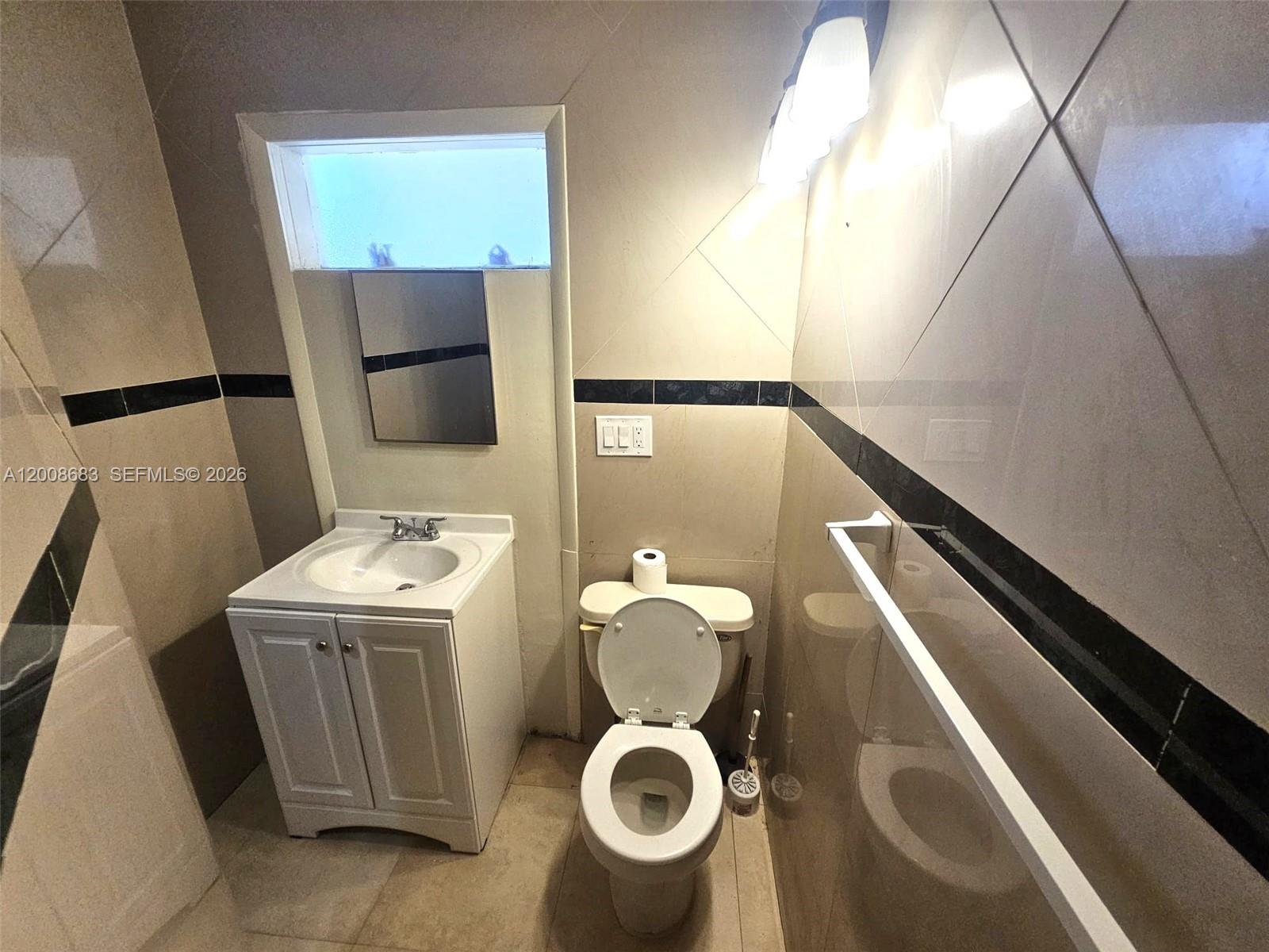 10790 Southwest 46th Street, Unit 10790 Miami, FL 33165 - Photo 12 of 19 a bathroom with a toilet and a sink
