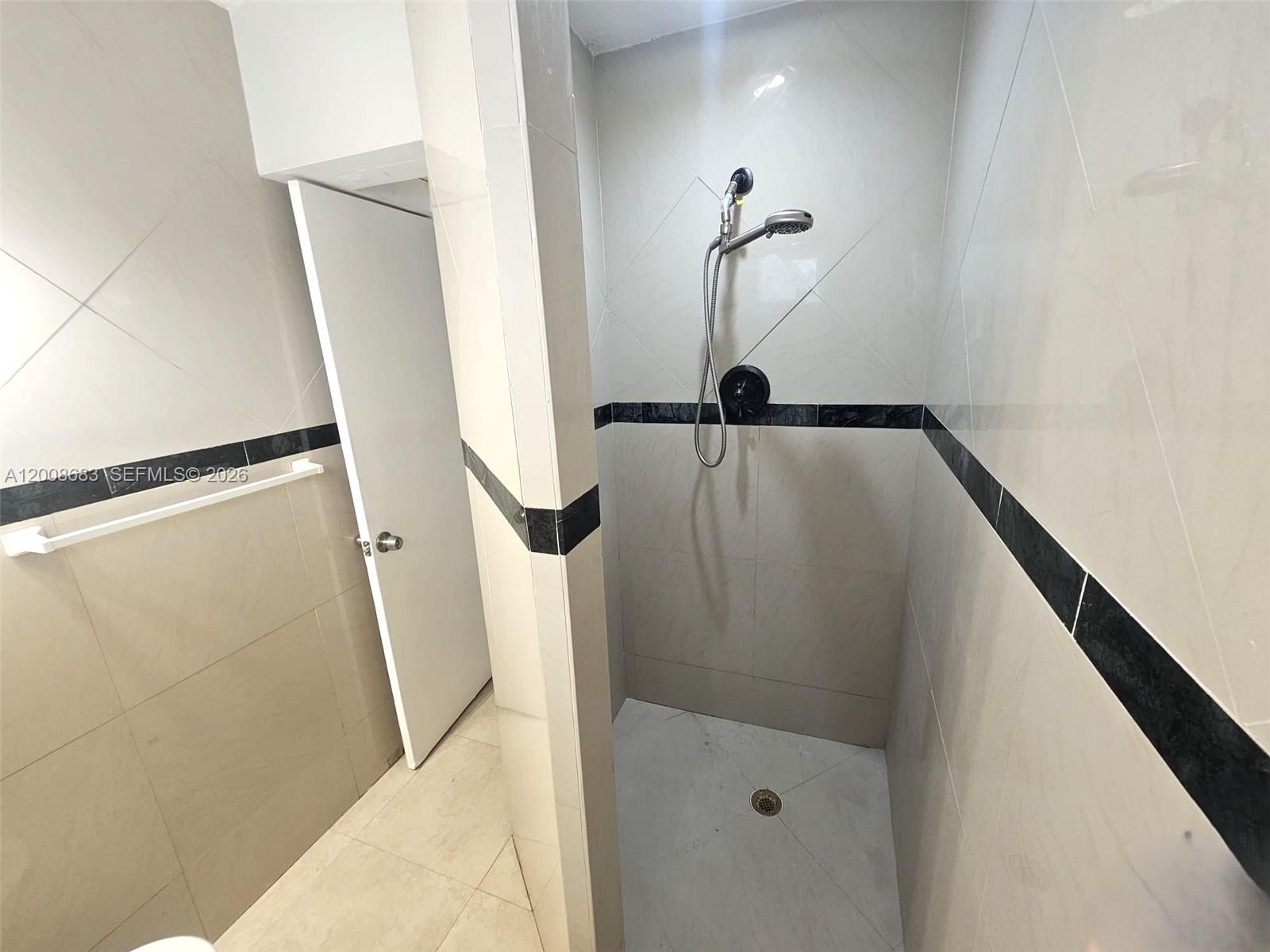 10790 Southwest 46th Street, Unit 10790 Miami, FL 33165 - Photo 13 of 19 a bathroom with a shower