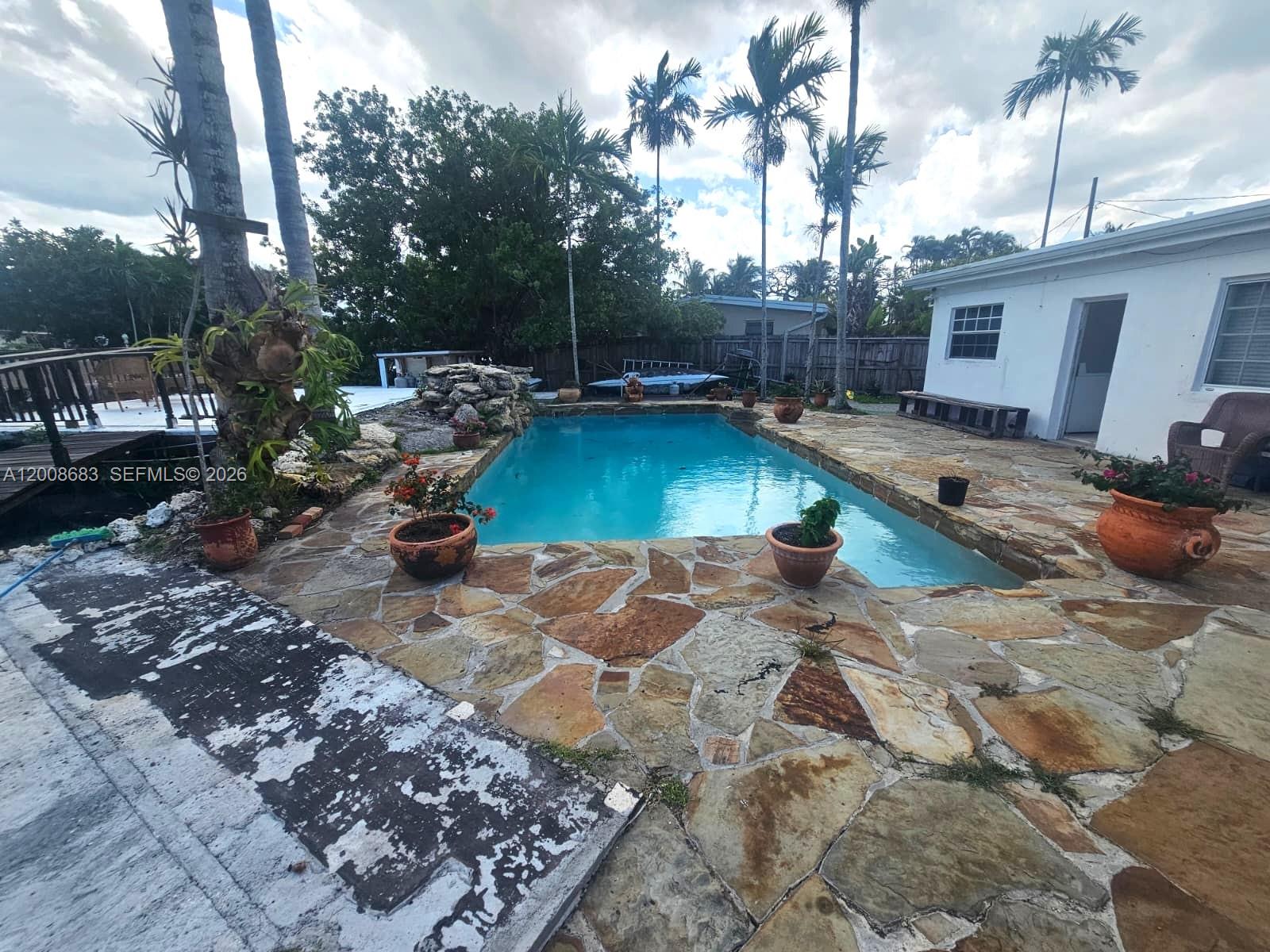 10790 Southwest 46th Street, Unit 10790 Miami, FL 33165 - Photo 16 of 19 a view of a backyard with sitting area