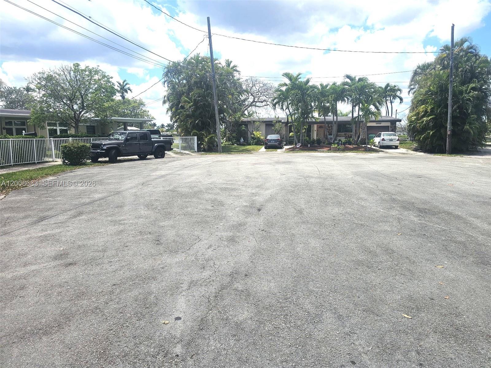 10790 Southwest 46th Street, Unit 10790 Miami, FL 33165 - Photo 19 of 19 a view of street with parked cars
