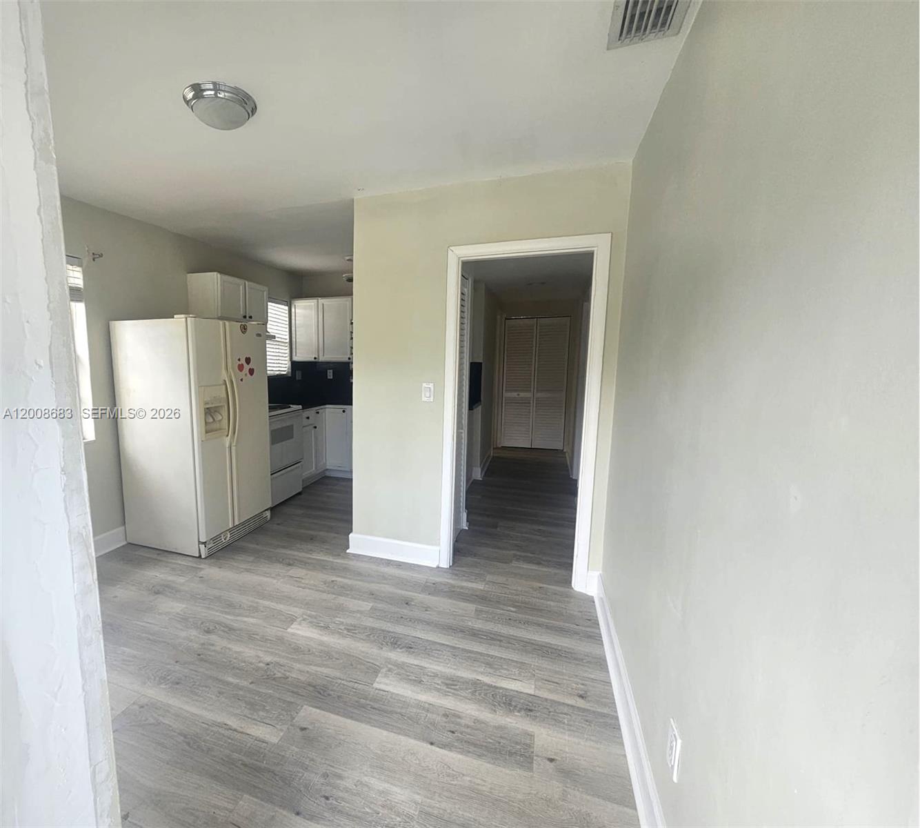 10790 Southwest 46th Street, Unit 10790 Miami, FL 33165 - Photo 9 of 19 a view of a kitchen with a sink and a refrigerator
