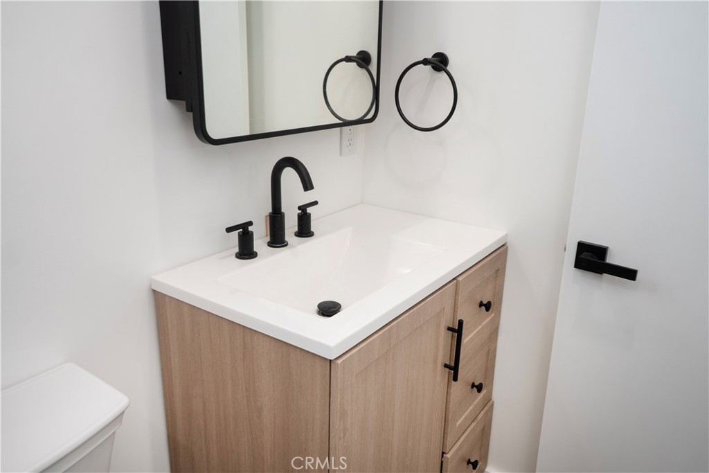 1571 Ricardo Street, Unit 2 Los Angeles, CA 90033 - Photo 22 of 29 a bathroom with a sink and a mirror